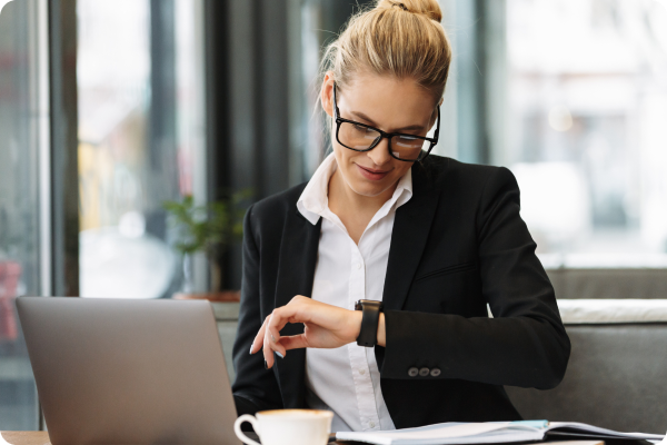 cheerful-business-woman-looking-watch-1